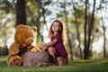 Little girl feed your teddy bear