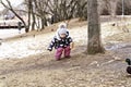 Little girl feeding pigeons in autumn in the park. Royalty Free Stock Photo