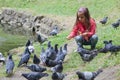 Little girl feeding pigeons Royalty Free Stock Photo