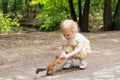 Little girl feeding squirrel