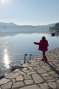 Little girl feeding swans