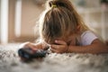 Little girl feeling scared while watching TV.