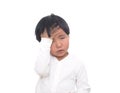 Little girl with a fever touching her forehead in front of white background Royalty Free Stock Photo