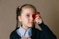 Little girl with Fidget Spinner held up to his eyes