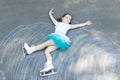 Little girl figure skating at imaginary skating rink arena