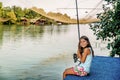 Little girl fishing on the river Bojana in Montenegro Royalty Free Stock Photo