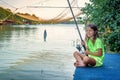 Little girl fishing on the river Bojana in Montenegro Royalty Free Stock Photo