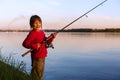 Little girl fishing with spinning Royalty Free Stock Photo