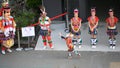 Cute little Taiwanese girl in garb with dancing group of Amis Tribe from Hualien Matainwith headdress and skirt, Kaohsiung, Taiwan