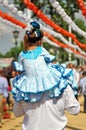 Little girl with flamenco dress on the shoulders of his father, Seville Fair, Andalusia, Spain Royalty Free Stock Photo