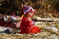 Little girl on floating Uros Islands Royalty Free Stock Photo