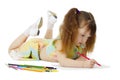 Little girl on floor drawing with crayons Royalty Free Stock Photo