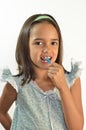 Little Girl Flossing her Teeth Royalty Free Stock Photo