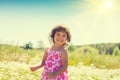 Little girl on the flower field