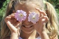 Little girl flowers on the eyes Royalty Free Stock Photo