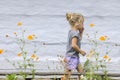 Little girl and flowers Royalty Free Stock Photo