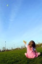 Little girl flying kite