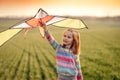 Little girl with flying kite Royalty Free Stock Photo