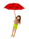 Little girl flying on red umbrella - ladybird Royalty Free Stock Photo