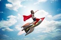 The little girl flying rocket in superhero concept Royalty Free Stock Photo