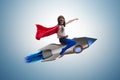 The little girl flying rocket in superhero concept Royalty Free Stock Photo