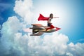 The little girl flying rocket in superhero concept Royalty Free Stock Photo