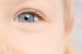 Little girl, focus on eye. Visiting children`s doctor Royalty Free Stock Photo