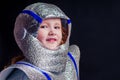 Little girl in foil diy space suit on a black background in the studio July 20, 1969 day of landing on the moon, child