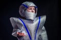 Little girl in foil diy space suit on a black background in the studio July 20, 1969 day of landing on the moon, child