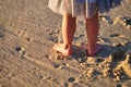Little girl Footprints in sand. Child Summer memories. Feet walk along shore. Royalty Free Stock Photo