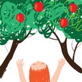 Little girl with freckles stretches her arms to a tree with red apples