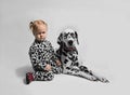 Little girl friends with Dalmatian dog Royalty Free Stock Photo