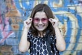 Little girl in front of graffiti wall Royalty Free Stock Photo