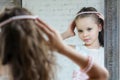 Little girl front the mirror