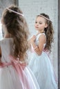 Little girl front the mirror