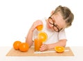 Little girl with fruits and vegetables make juice Royalty Free Stock Photo