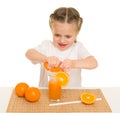 Little girl with fruits and vegetables make juice Royalty Free Stock Photo