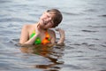 Little girl fun playing in the river dives and splashes Royalty Free Stock Photo