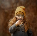 Little girl funny face portrait with magnifier