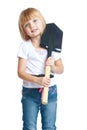 Little girl in the garden holding a shovel Royalty Free Stock Photo