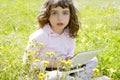 Little girl on garden meadow notebook computer Royalty Free Stock Photo