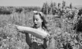 Little girl gardening harvesting big vegetable marrow, fertilisers concept Royalty Free Stock Photo