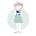 Little girl with garlands of flowers in her hair holding a bouquet of wild violets Royalty Free Stock Photo