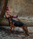 Little girl with German shepherd 6-th months puppy at early spring