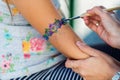 Little girl getting glitter tattoo