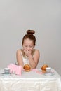 Little girl giggling at tea party Royalty Free Stock Photo