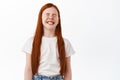 Little girl with ginger hair and freckles laughing. Kid having fun, chuckle over funny joke, giggle with happy face