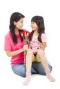 Little girl giving carnation flowers