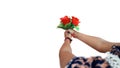 little girl giving roses bouquet to someone isolated photo