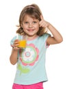 Little girl with a glass of orange juice Royalty Free Stock Photo